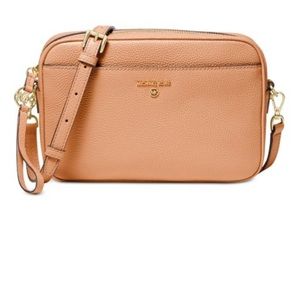 Michael kors jet set charm large EW signature leather crossbody bag.